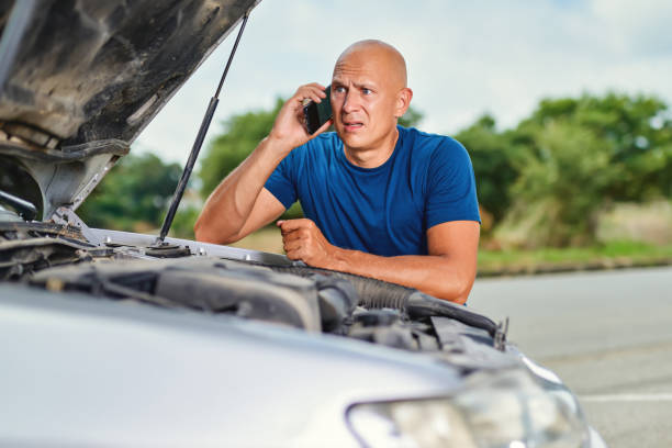 istock upset driver man in front car collision accident in road 1269809337