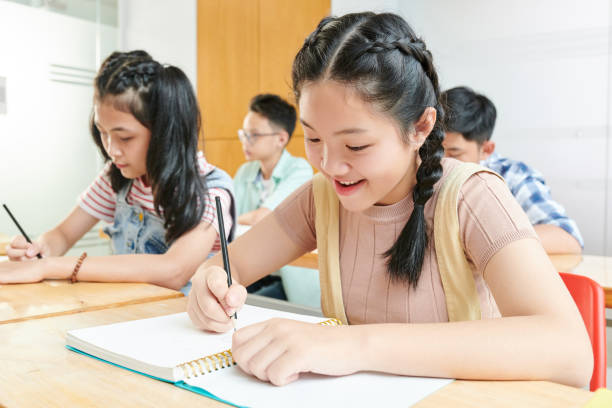 istock School children writing in textbooks 1269809537