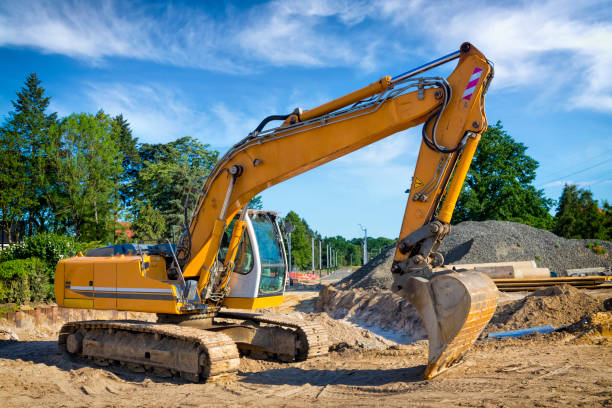 istock Yellow excavator on a road construction site 1269812281