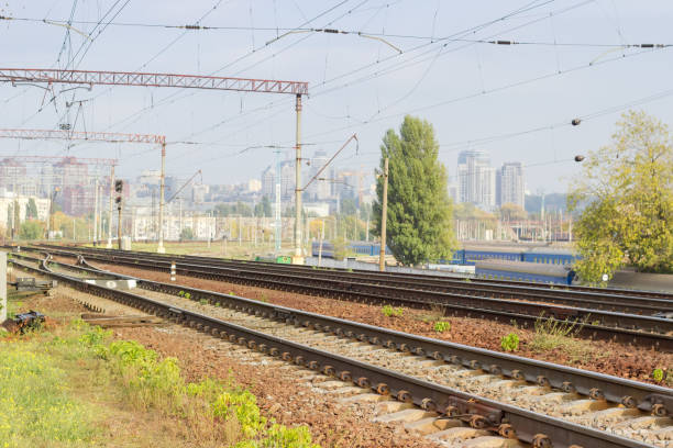 istock Modern multi-track railway on a background of urban structures 1269812313