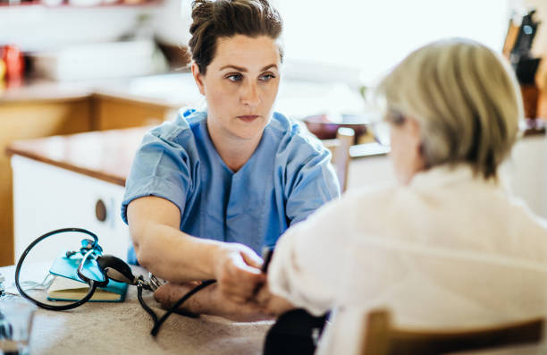 istock Nurse visiting a senior patient at home 1269813106