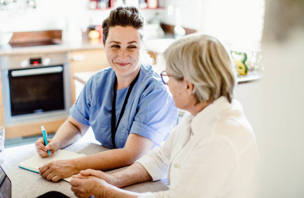 istock Nurse visiting a senior patient at home 1269813482