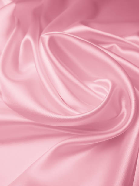 istock Beautiful elegant wavy light pink satin silk 1269813513