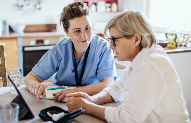 Nurse visiting a senior patient at home