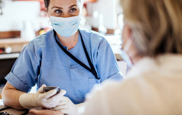 istock Nurse visiting a senior patient at home 1269814359
