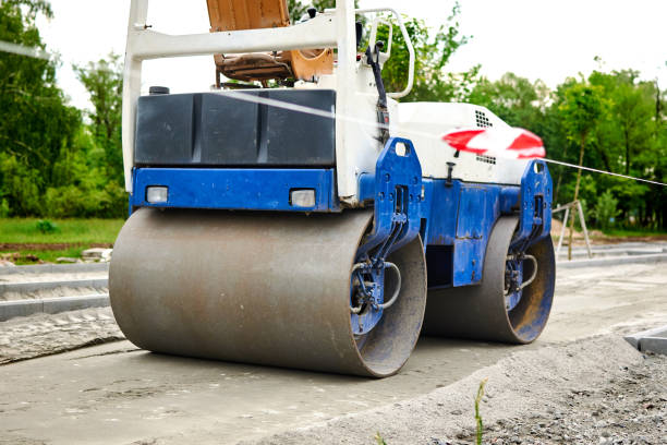 istock Men at work. The construction roller makes the road. Make a new road surface. 1269814423