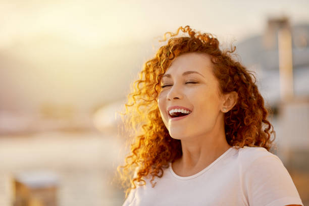 istock Woman singing on the beach 1269814650