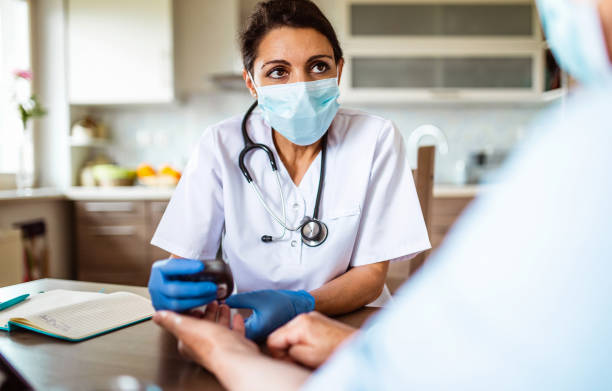 Nurse visiting a senior patient at home Nurse visiting a senior patient at home diabetes epidemiology stock pictures, royalty-free photos & images