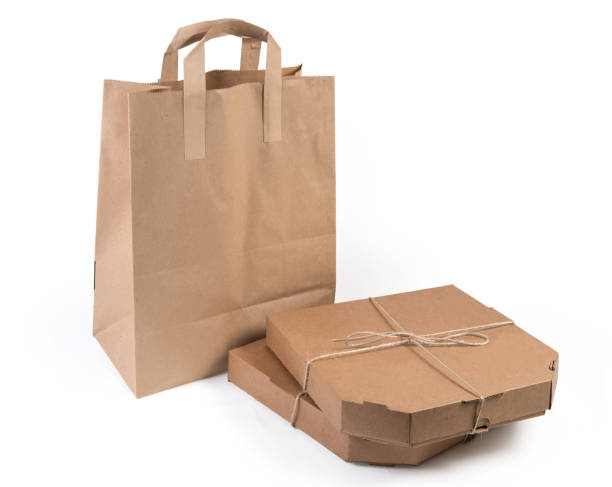 istock Two pizza and other meals in packaging for delivery 1269815650