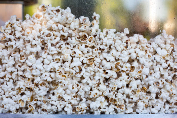 istock Heap of fresh made popcorn in machine 1269819424