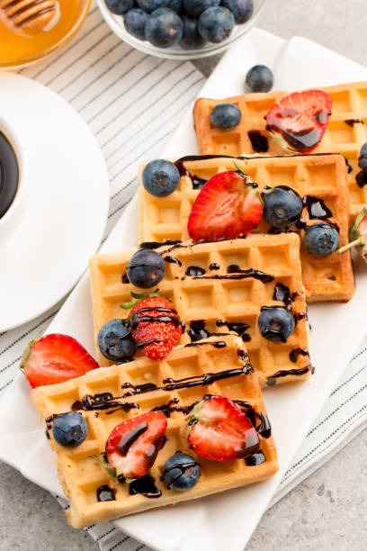 istock Belgian waffles for breakfast. Dessert food concept. 1269819486