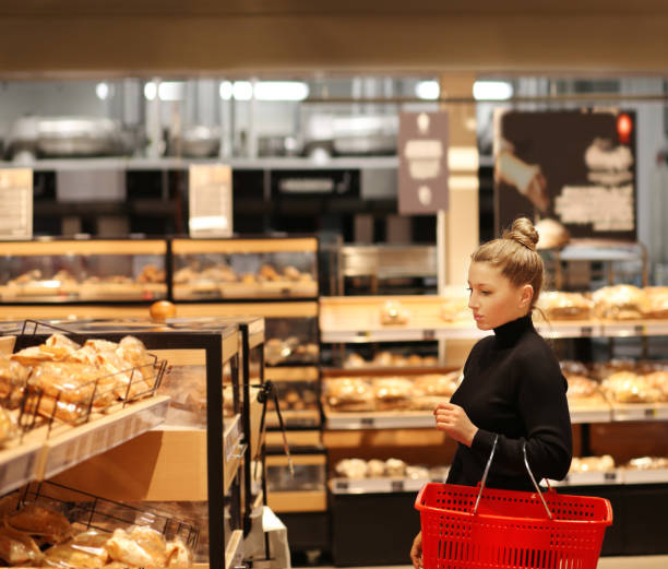 istock Woman choosing bread  from a supermarket 1269822287
