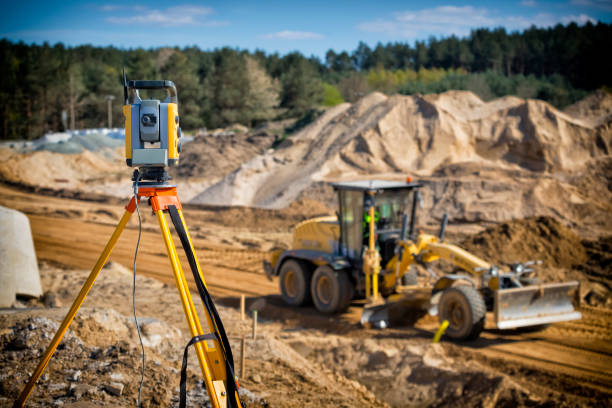istock Landsurveyor equipment on a highway construction site 1269823941