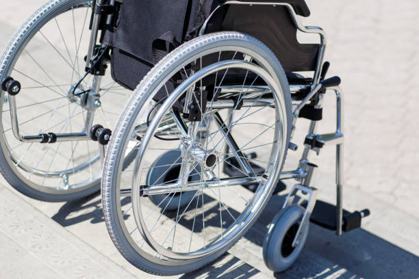 istock Wheelchair near the steps outdoors in the park. 1269824082