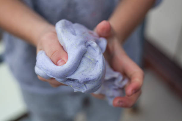 istock The child crumples plasticine in his hands. 1269824986
