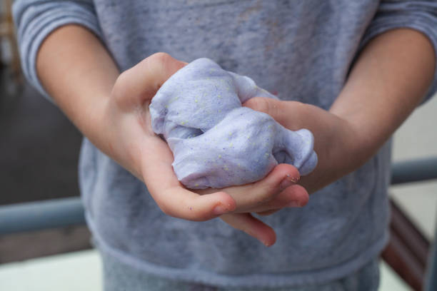 istock The child crumples plasticine in his hands. 1269825087
