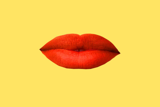 istock Woman's lips close up isolated on yellow background 1269825279