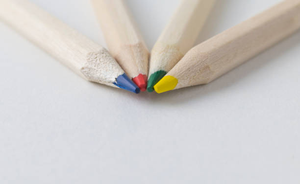 istock four colored pencils on a white background, close-up, macro, copy space 1269827656