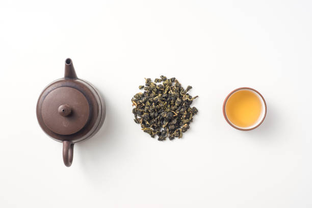 fresh taiwan oolong tea and teapot Asia culture and design concept - fresh taiwan oolong tea and teapot oolong tea stock pictures, royalty-free photos & images