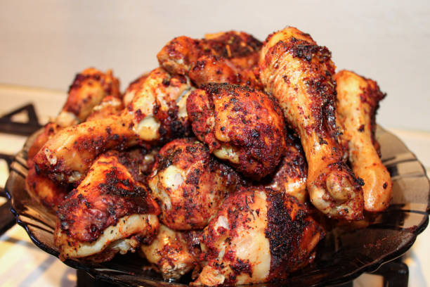 istock Baked chicken drumsticks. Chicken legs in the oven. 1269828378