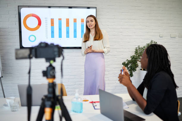 istock Successful female CEO reporting business statistic on a web conference in board room 1269829171