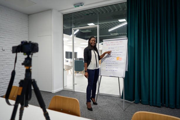 istock Expertised media manager streaming her online seminar for her client during COVID-19 isolation period 1269829178