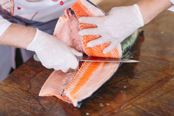 istock The chef cuts the salmon on the table 1269829878