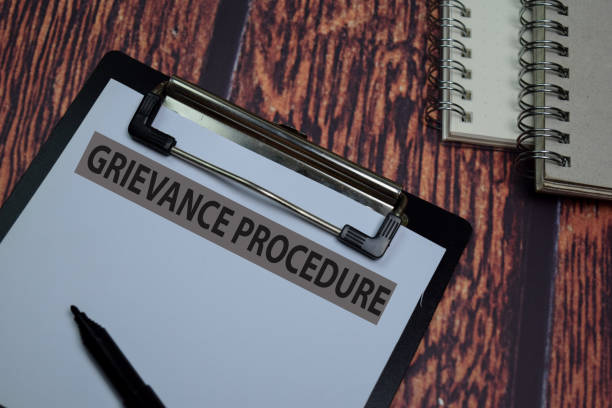 istock Griecanve Procedure write on paperwork isolated on wooden table. 1269829902