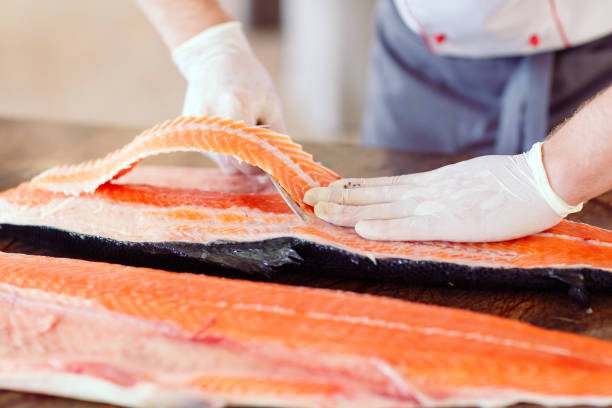 istock The chef cuts the salmon on the table 1269829903