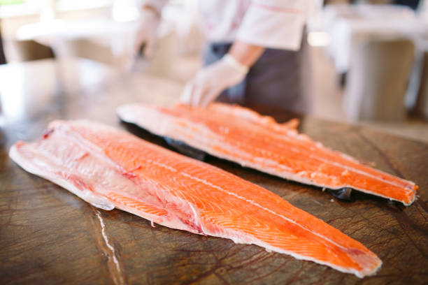 istock The chef cuts the salmon on the table 1269829942