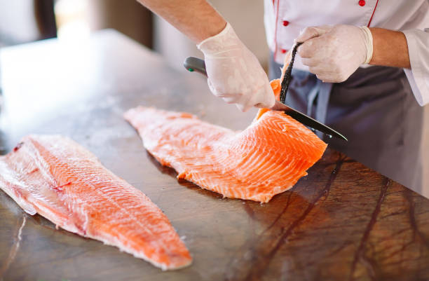 istock The chef cuts the salmon on the table 1269829965