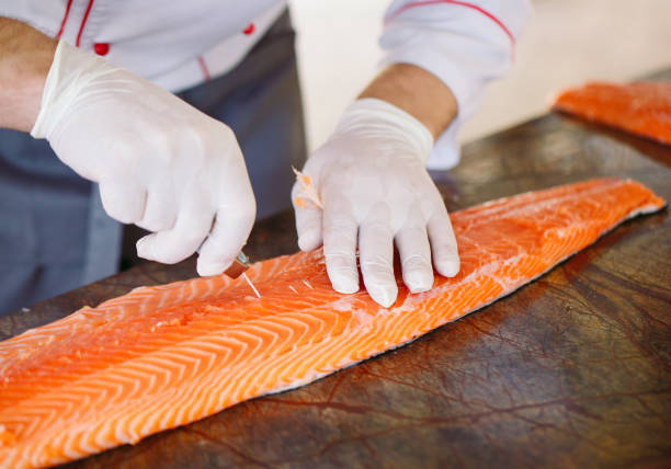 istock The chef cuts the salmon on the table. 1269830156