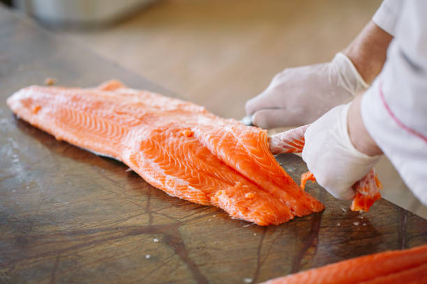 istock The chef cuts the salmon on the table. 1269830748
