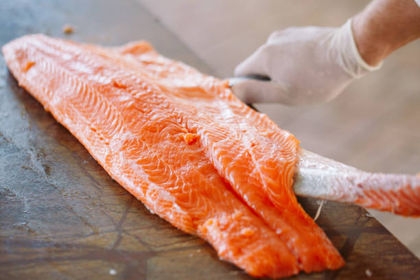 istock The chef cuts the salmon on the table. 1269830757