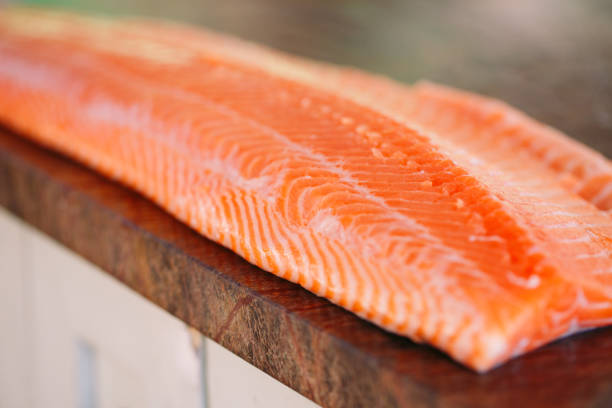 istock Fish Salmon on the cooking table of a cook 1269830764