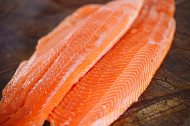 istock Fish Salmon on the cooking table of a cook 1269830795