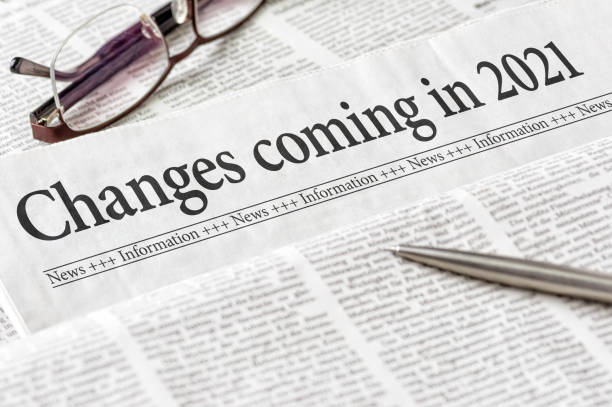 A newspaper with the headline Changes coming in 2021 A newspaper with the headline Changes coming in 2021 front page stock pictures, royalty-free photos & images