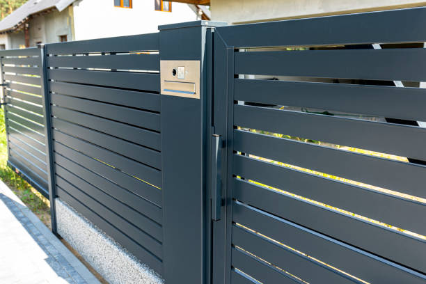 istock A modern videophone with a letterbox and a wireless card reader, mounted in panel fence in anthracite color, visible wicket. 1269831114
