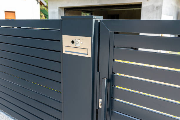 istock A modern videophone with a letterbox and a wireless card reader, mounted in panel fence in anthracite color, visible wicket. 1269831129