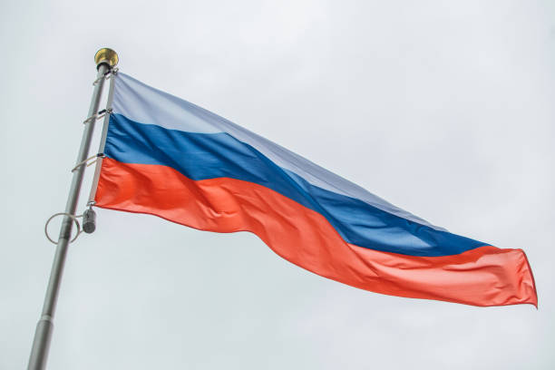 istock Russian flag waving on a flagpole 1269832250