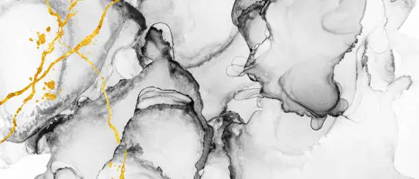 Photo of Black and white abstract texture with gold accents, trendy wallpaper. Alcohol ink.