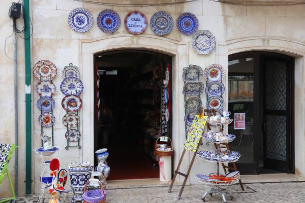 Hand painted tableware Ceramic traditional handicraft tableware in a souvenir shop in Alcobaca. 21.2 million tourists visited Portugal in 2016. alcobaca photos stock pictures, royalty-free photos & images