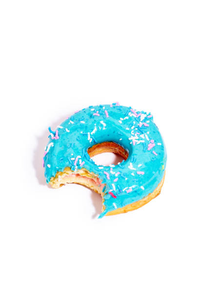 istock Sweet blue glazed donut bitten from one side 1269840470