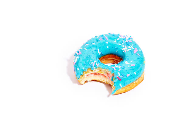 istock Sweet blue glazed donut bitten from one side 1269840478