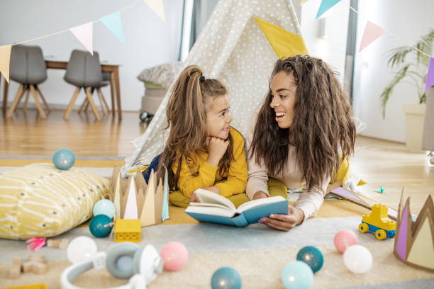 istock A young mother is reading a book to the daughter 1269841354