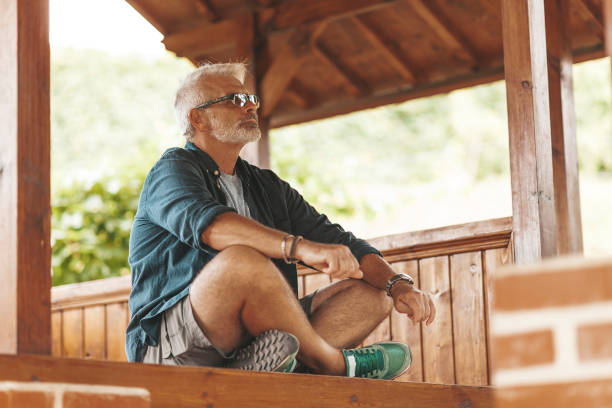 Young man relaxing on balcony