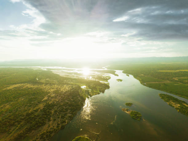 lower zambezi river at sunset hour drone view on the river of lower zambezi area in Zambia at sunset hour estuary photos stock pictures, royalty-free photos & images