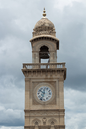A Beautiful Close up view of the famous Heritage Dufferin Clock Tower built over a Century ago against an overcast sky in Mysuru cityscape of Karnataka state in India.