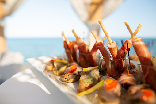Delicious colourful mediterranean appetizers at party with selective focus