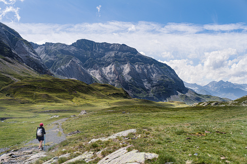 La Thuile, Aosta Valley, Italy - August 7, 2020: On the pathway from Lac d'Arpy to Col de la Croix (Mont Blanc massif). In the background, Mont Colmet.